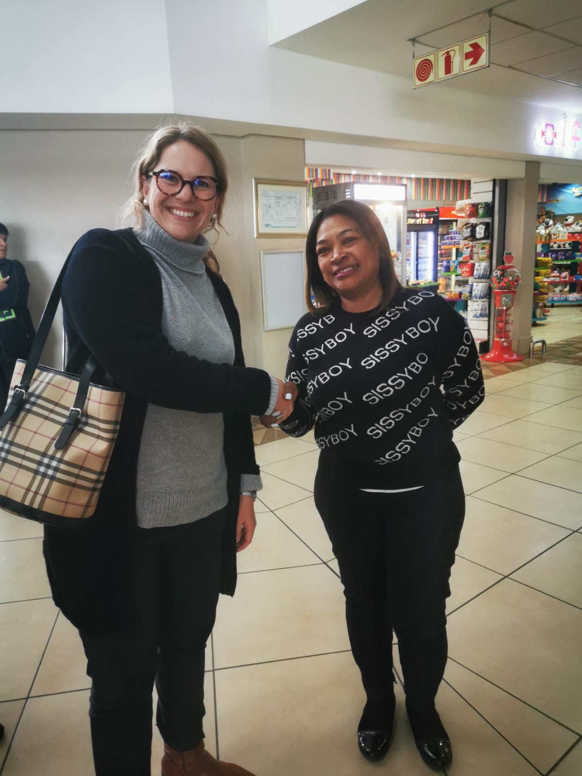 Minister of Finance and Economic Opportunities, Mireille Wenger with George Airport Manager, Brenda Voster