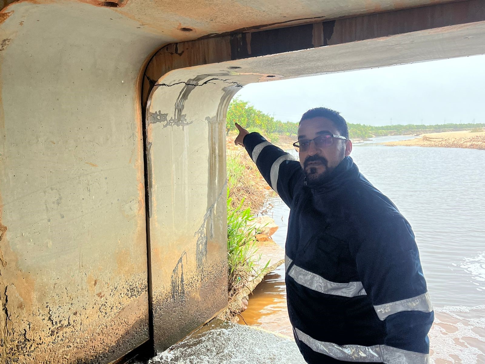 Minister Simmers inspected the damaged culvert