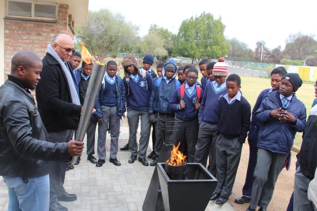 A symbolic Olympic torch is lit in Oudtshoorn.