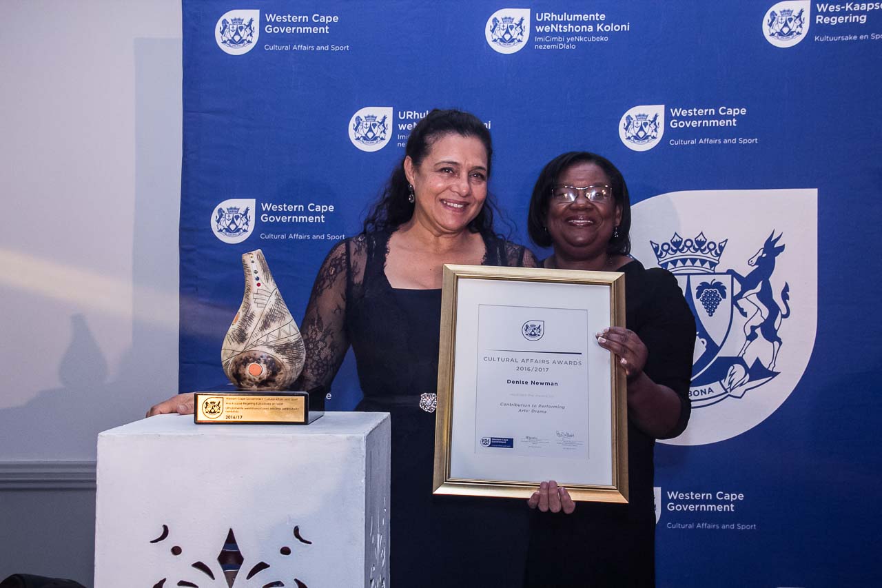 Actress Denise Newman receives her 2016/17 Cultural Affairs Award from Director Jane Moleleki