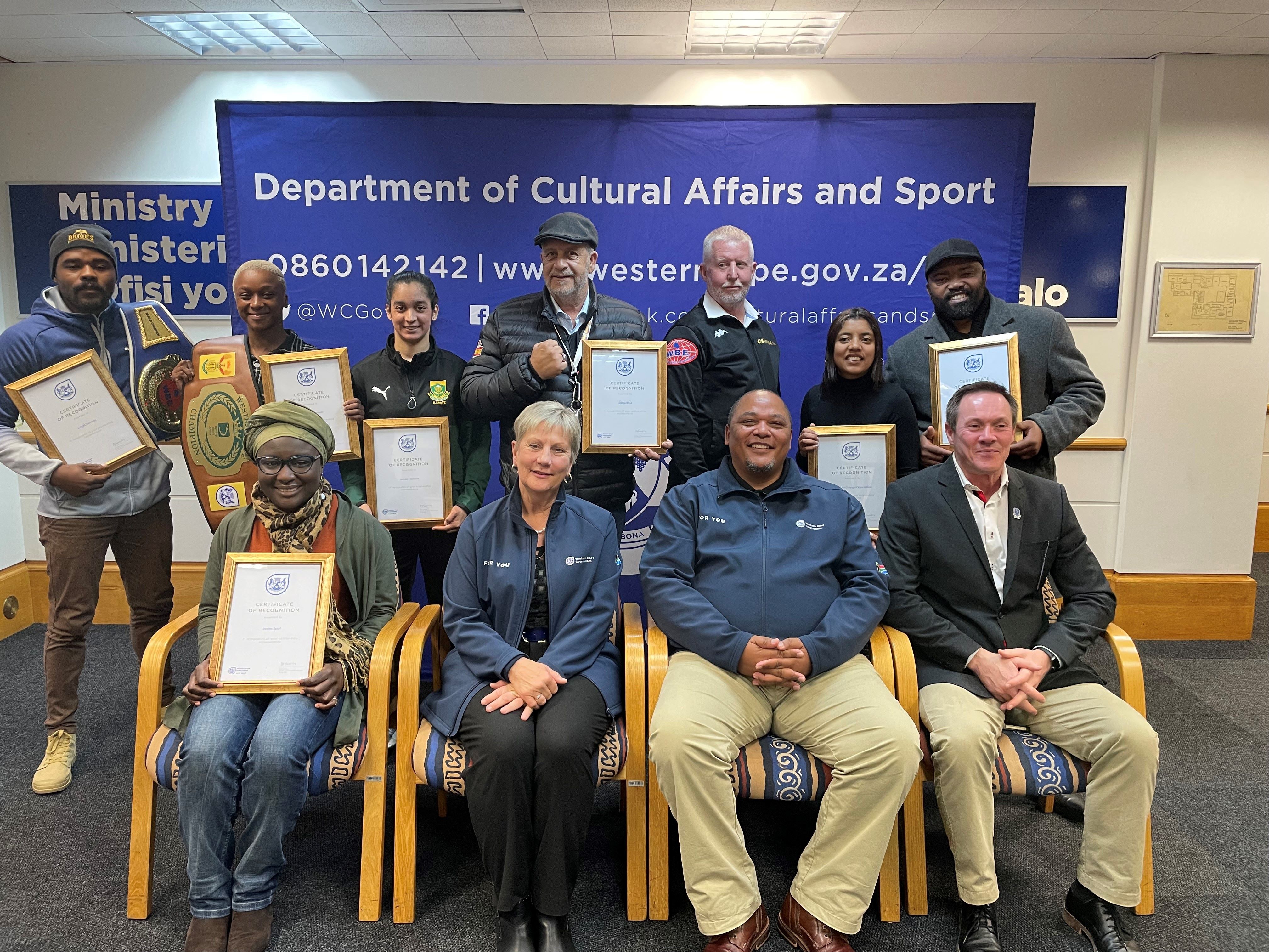 The athletes with Minister Anroux Marais and DCAS head of Department, Guy Redman.