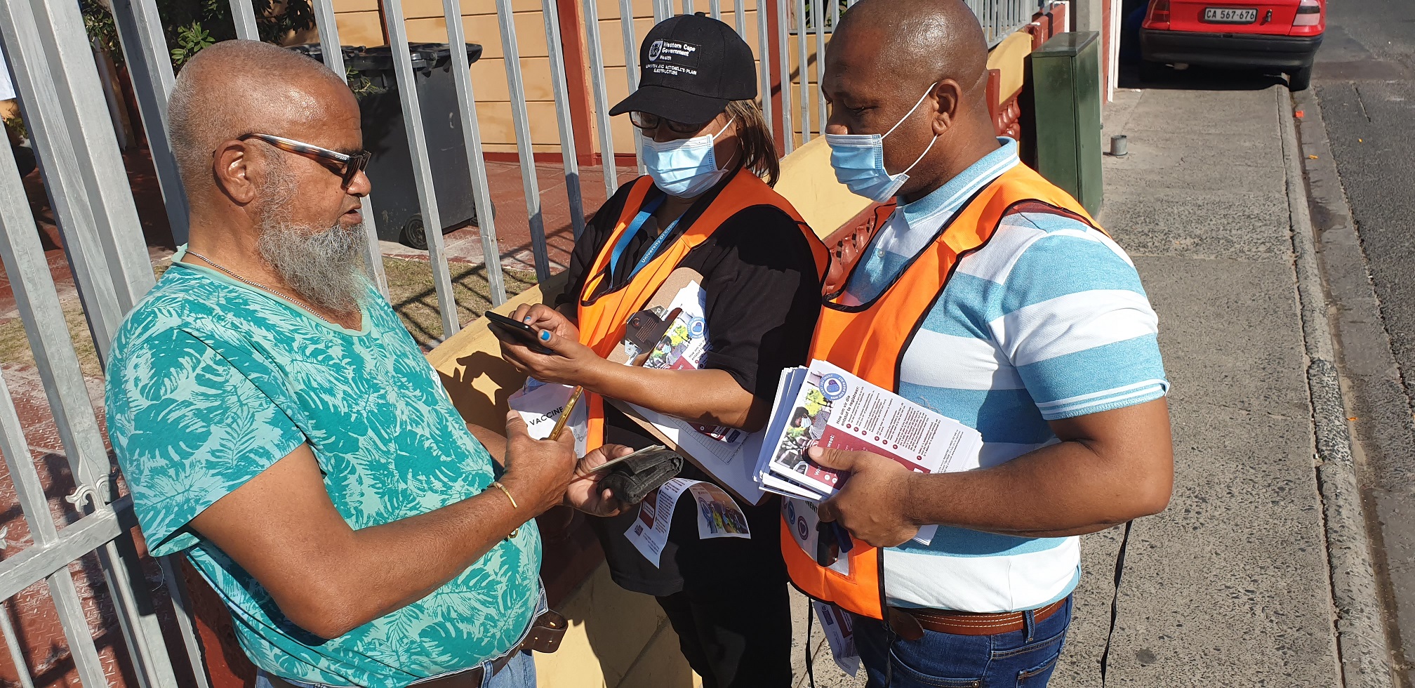 Anthea Abrahams and Andile Zabeko registering Mogamat Kassiem Bester on EVDS.