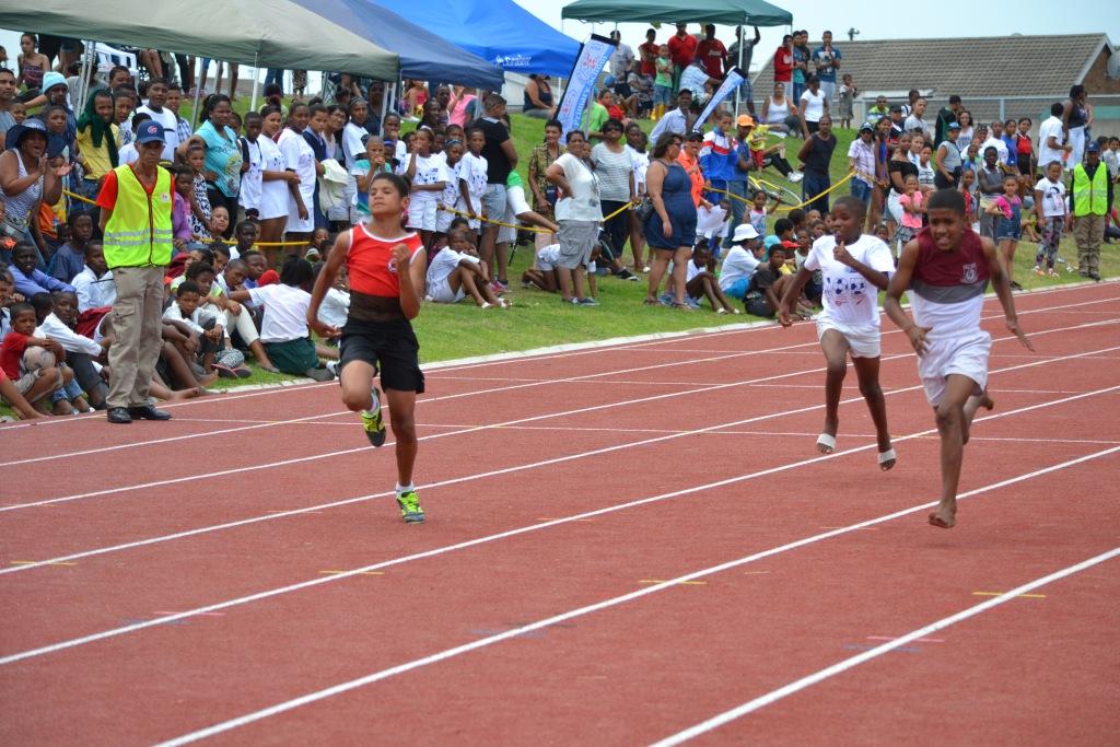 Athletes competing on the new athletics track