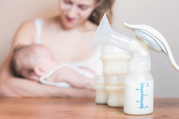 Woman feeding baby