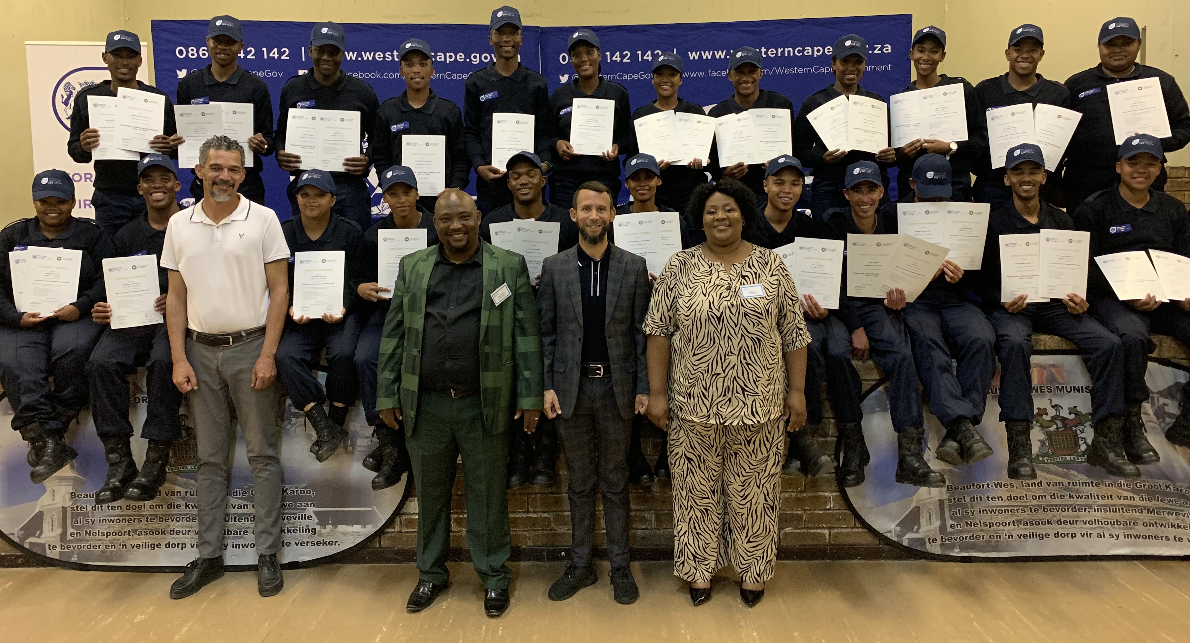 Dignitaries standing in front, L-R: Councillor Schaun Meyers, Beaufort West Executive Mayor, Mr Gideon Pietersen, Western Cape Minister of Police Oversight and Community, Reagen Allen and Beaufort West Deputy Executive Mayor, Ms Lulama Piti