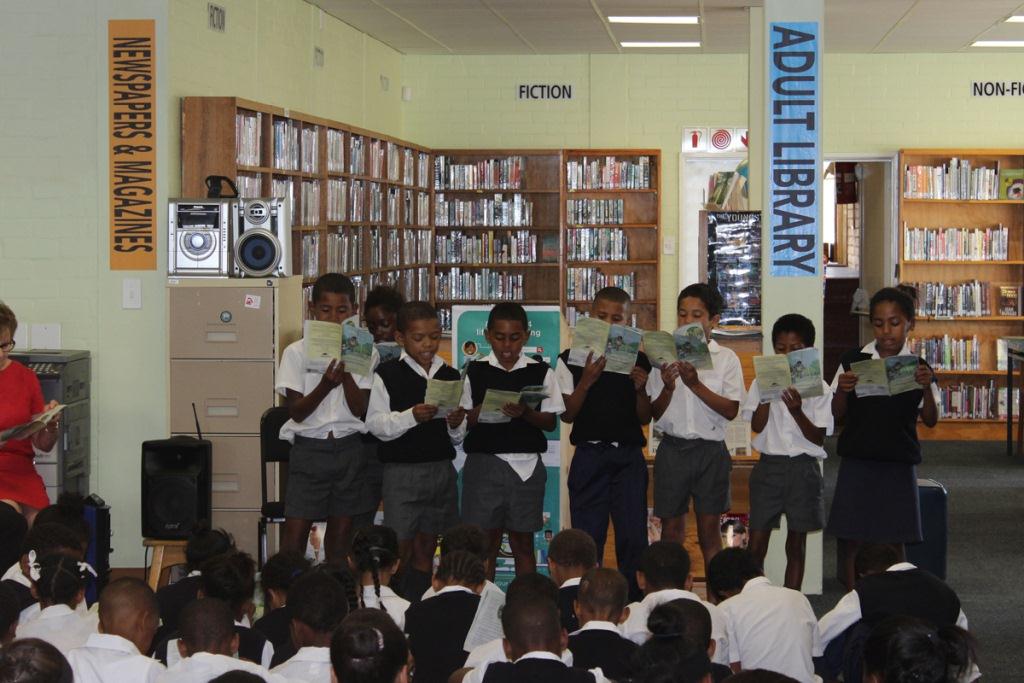 Children participating in a reading session inside the new library