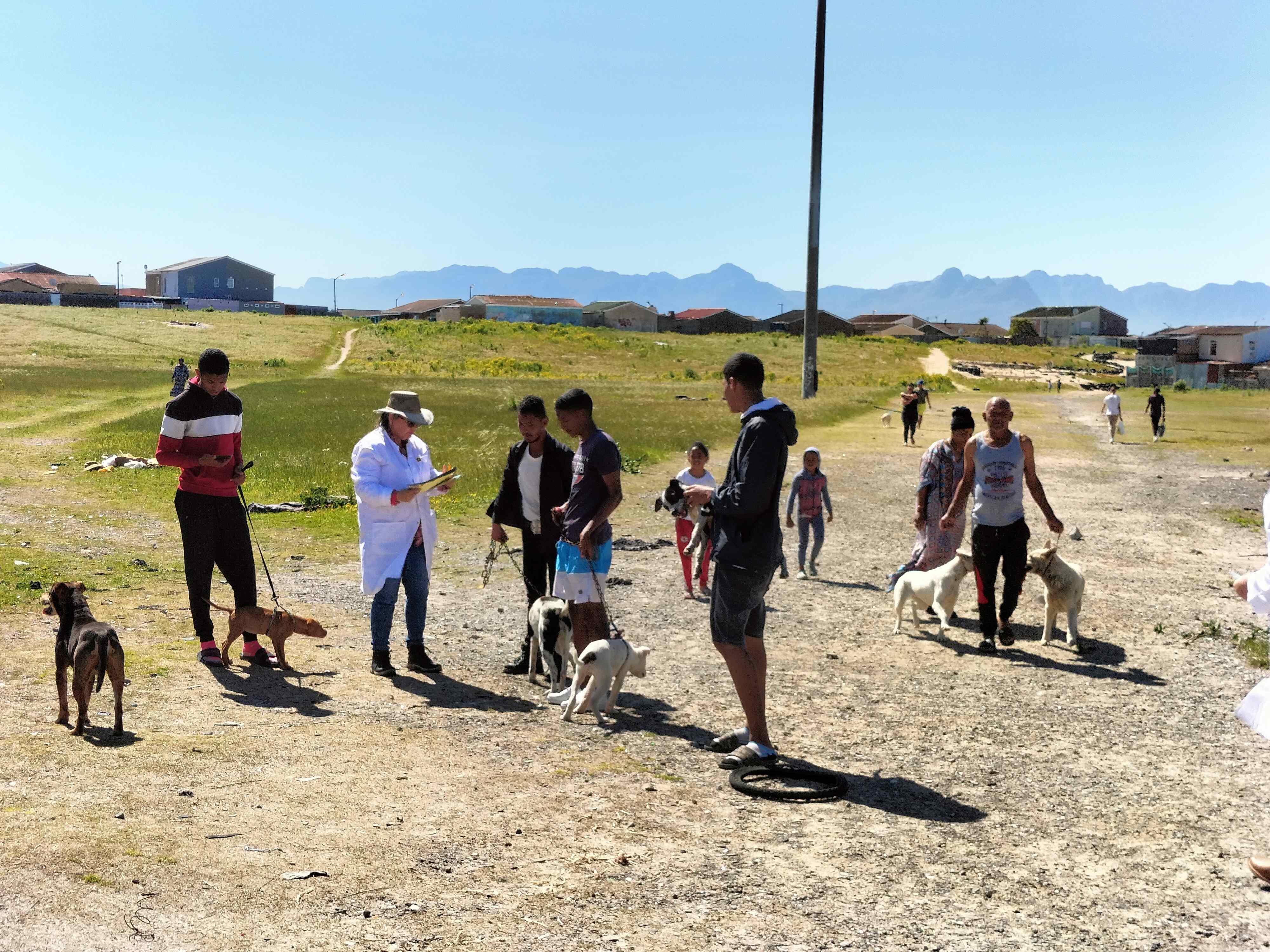  Community members arriving with pets for free rabies vaccination