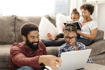 A family relaxing and doing some reading