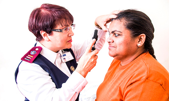 Nurse examining patient. 