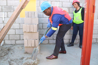 Minister Bonginkosi Madikizela joins the Nelson Mandela Day Initiative to build 100 homes for 100 families