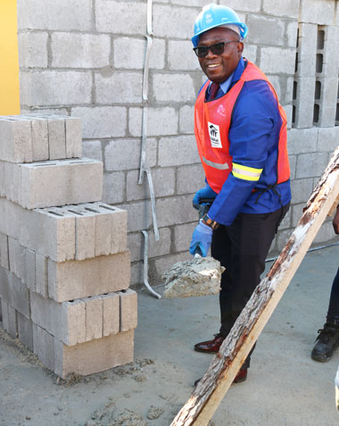 Minister Bonginkosi Madikizela joins the Nelson Mandela Day Initiative to build 100 homes for 100 families