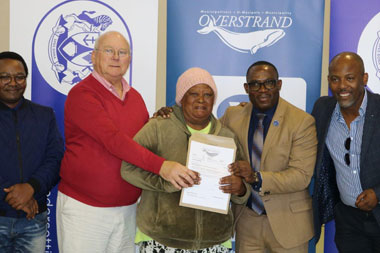 Hawston Resident Receives Title Deeds From Minister Madikizela