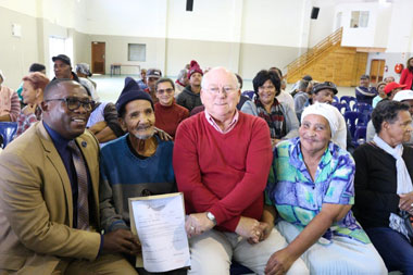 Hawston Resident Receives Title Deeds From Minister Madikizela