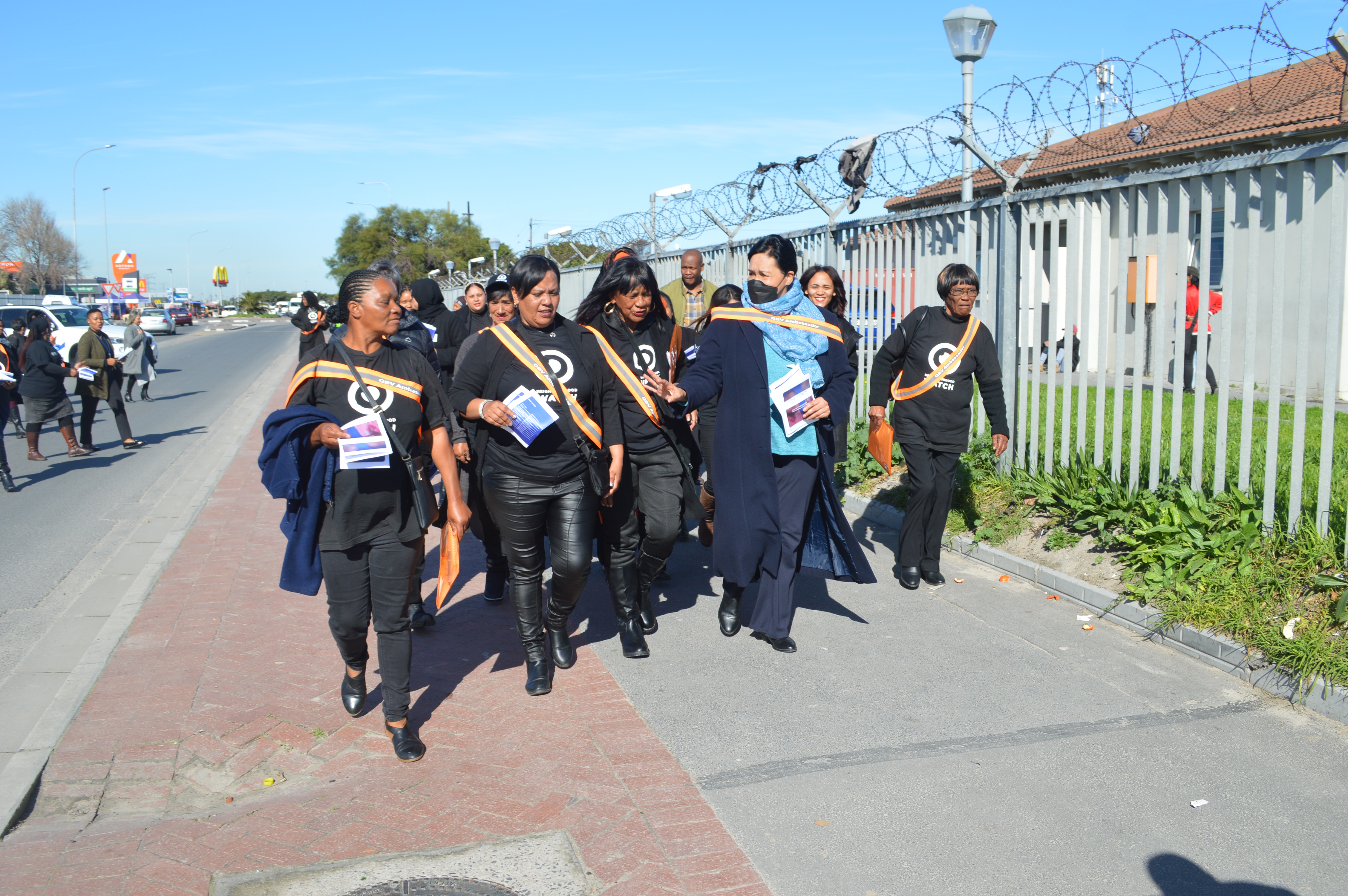 Provincial Minister Sharna Fernandez handing out pamphlets with GBV ambassadors