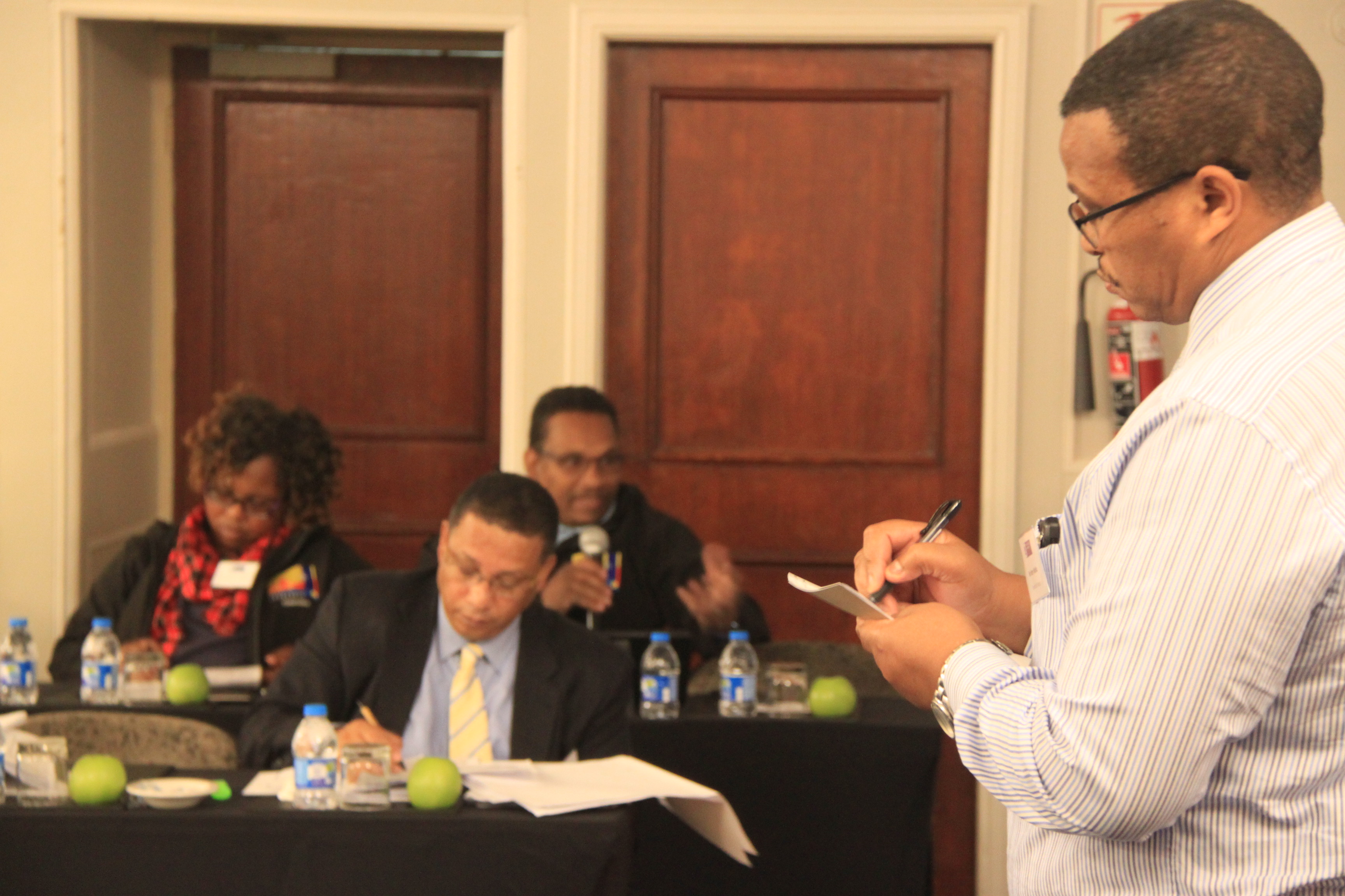 Minister Ivan Meyer (centre) and Mr Harry Malila from the Provincial Treasury during a panel discussion