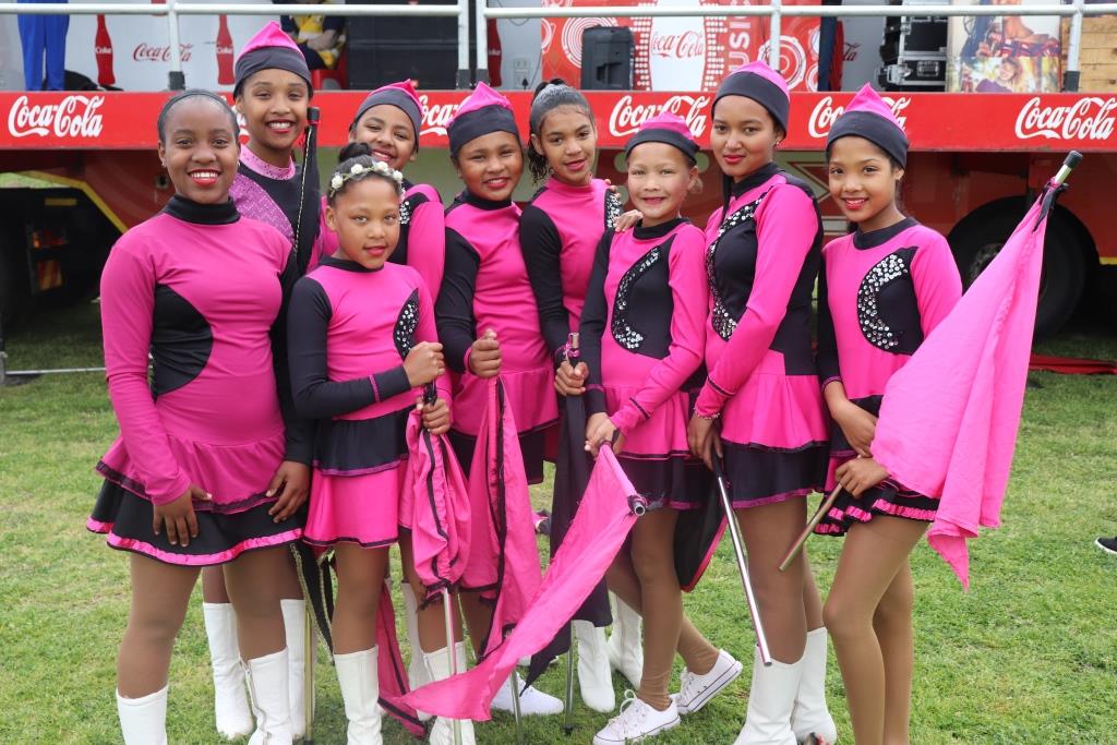 Local drum majorettes entertain the crowd with their dainty routines