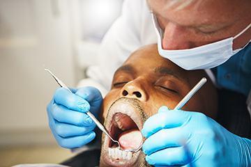 Man visiting the dentist for a check-up.