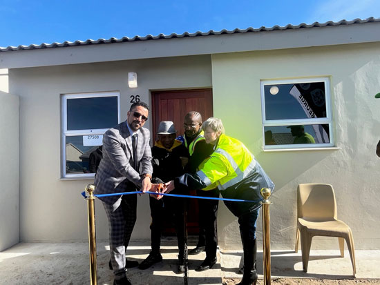 Provincial Minister of Infrastructure, Tertuis Simmers, handed over 24 brand new houses to qualifying beneficiaries at the Metro Grounds Development in George