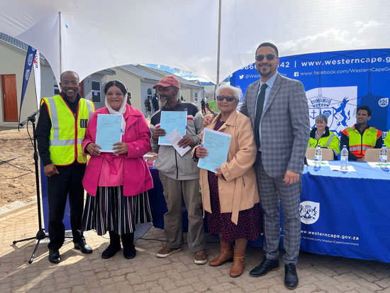 Provincial Minister of Infrastructure, Tertuis Simmers, handed over 24 brand new houses to qualifying beneficiaries at the Metro Grounds Development in George