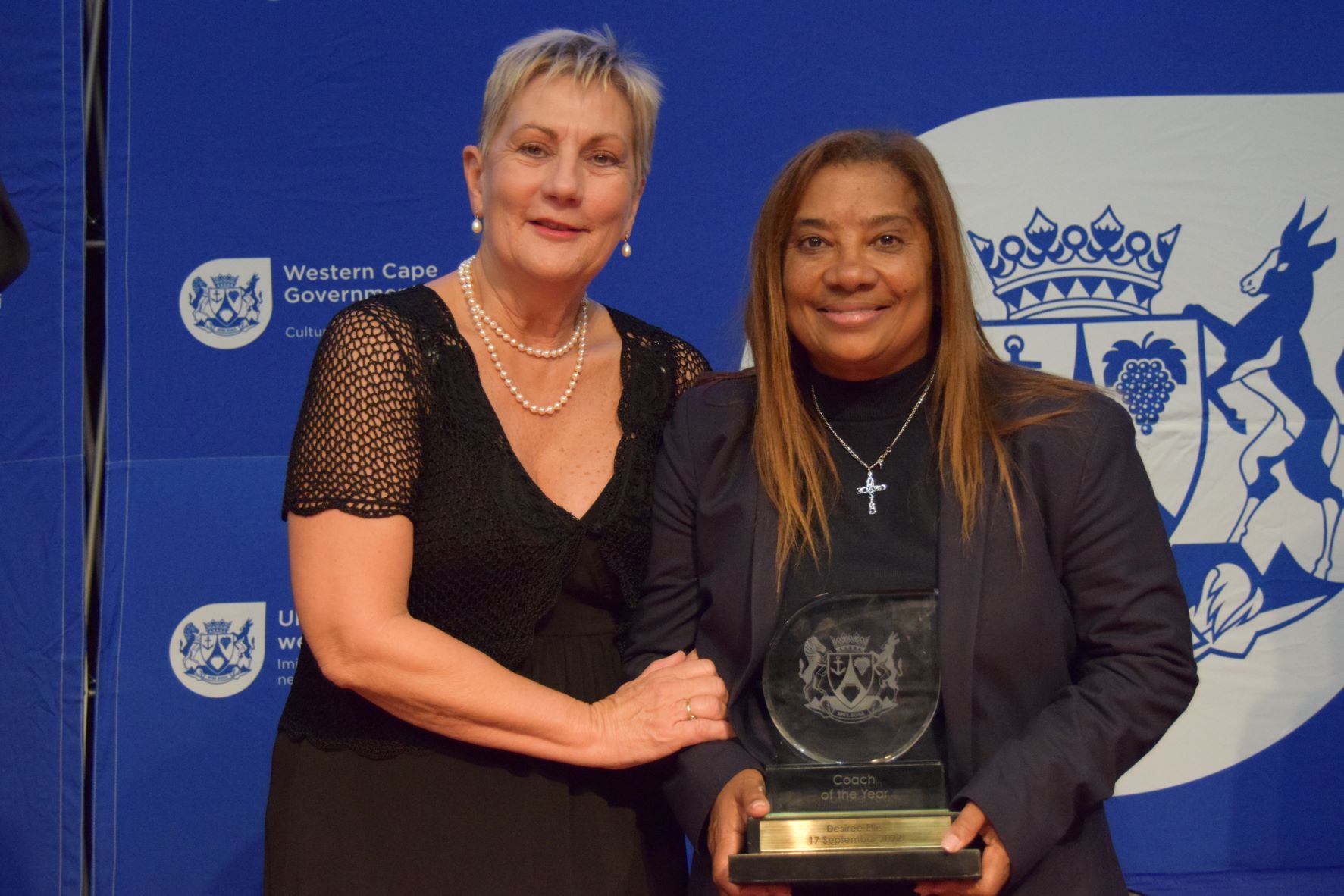 Minister Anroux Marais, with Coach of the Year winner Desiree Ellis.