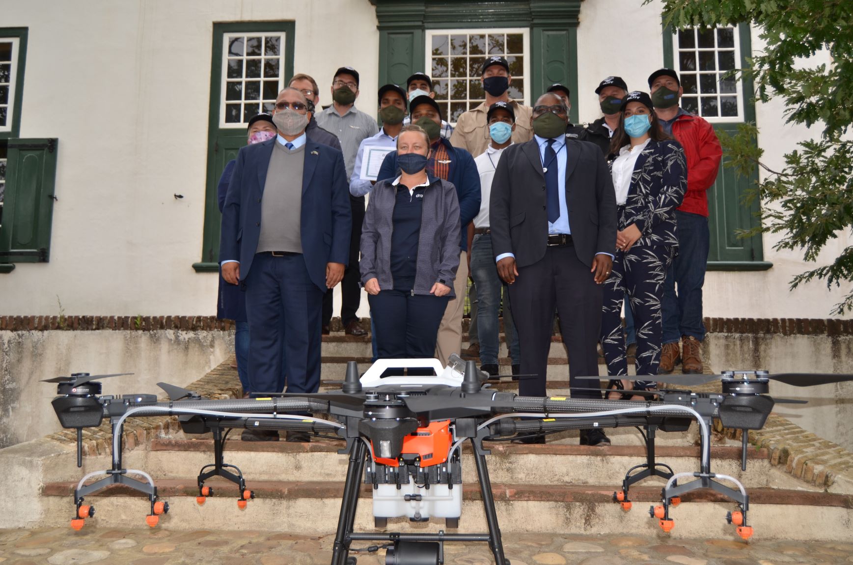 Minister Meyer, HOD Dr Mogale Sebopetsa with group of drone pilots