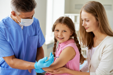 Mom taking young daughter to get vaccinated