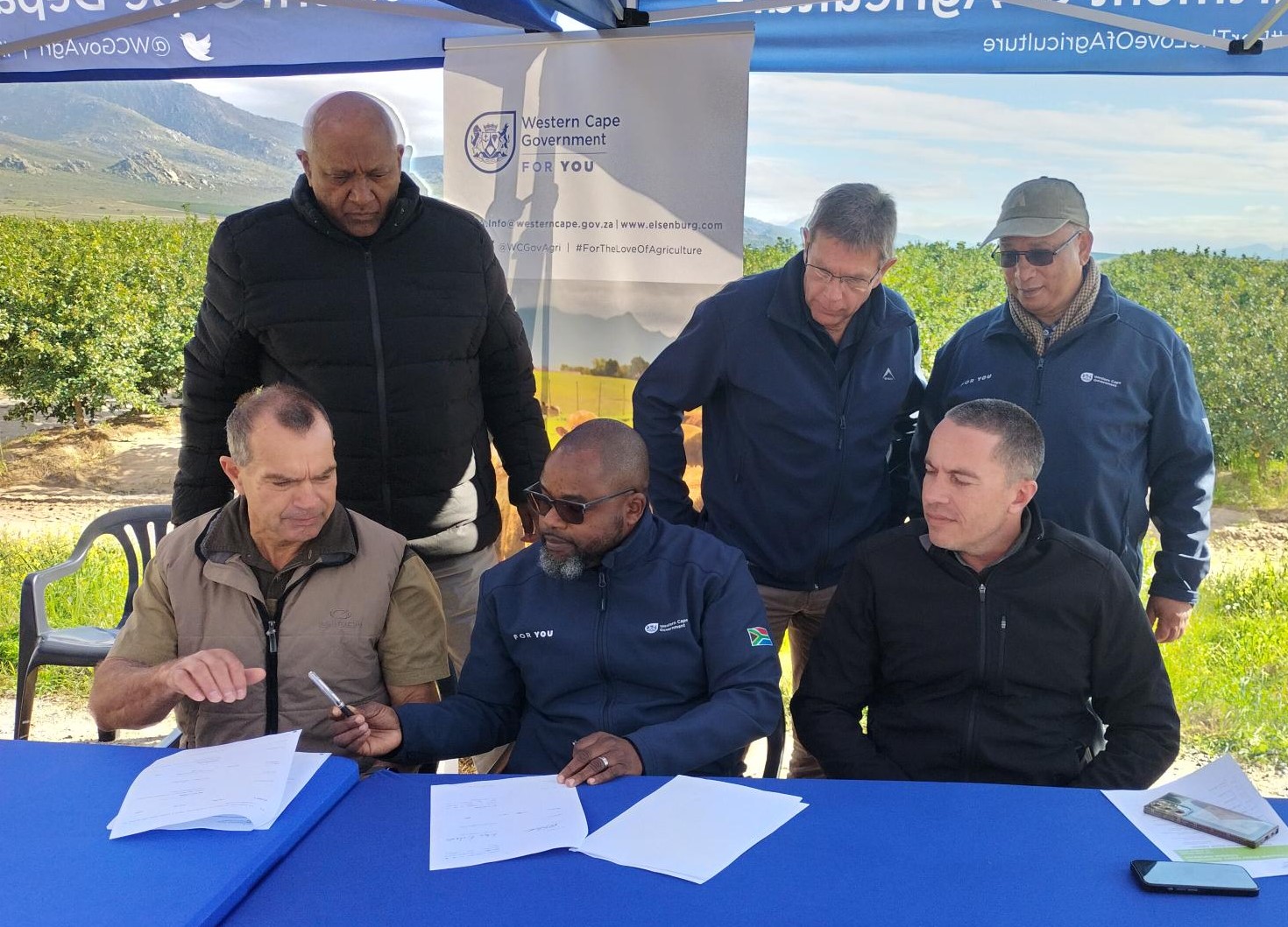 Front row: L-R  - Mr  Jannie Toerien - (Citrusdal Water Users Association); Dr Mogale Sebopetsa ( Head of Department: WC DoA); Stefan Theron (Citrusdal Water Users Association)