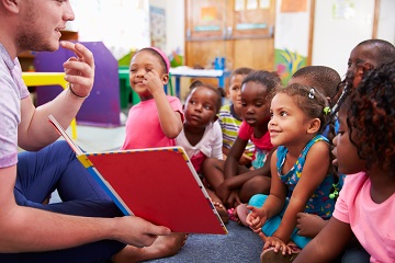 Volunteer reading to children