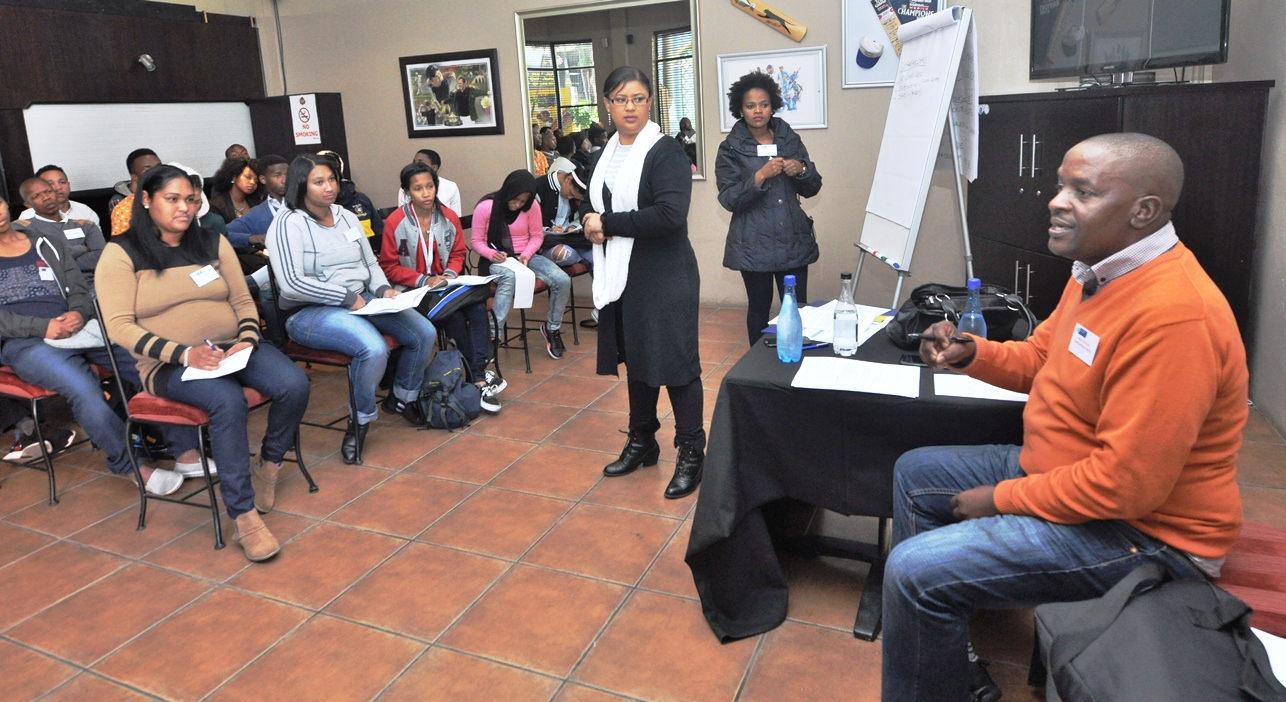 Road safety officer Tamsanqa Pantsi engages with participants.