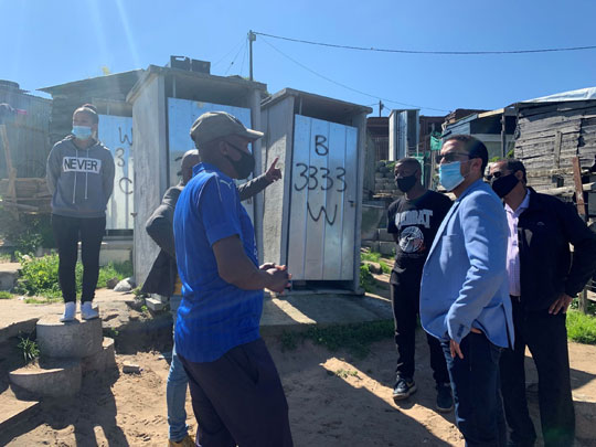 L-R : Vemensia Galant, Vuyisile Pauli Chairperson of Smutsville Informal Settlement Forum, Freegan Galant and Minister Tertuis Simmers 