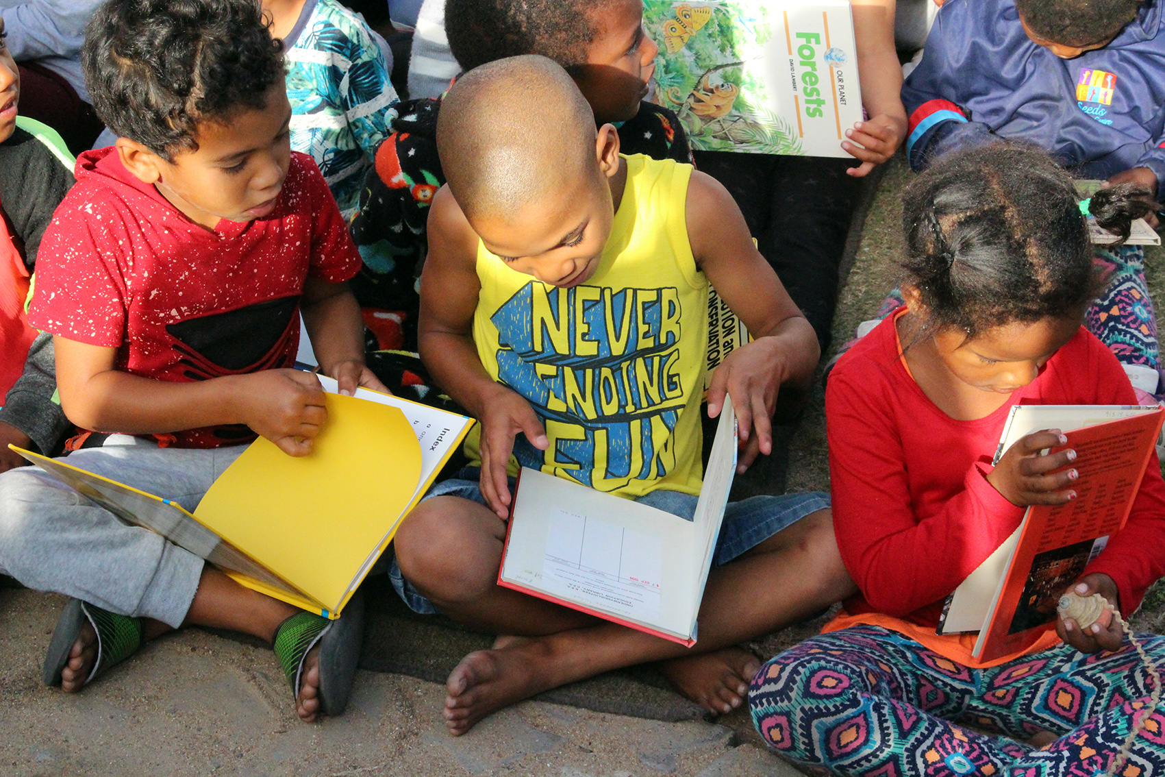 Students from Pearls Little Ones excited to read their new books