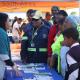 Members of the community listen as Ms Chantell Hendricks (left), of DOCS educates them on the various projects the Department. 