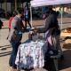 Minister Simmers engaging residents in Pacaltsdorp and purchasing a boerewors roll from a vendor in Thembalethu