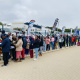 Braving the cold, Saron community members queue for essential services from various government departments, showcasing the critical importance of outreach efforts in meeting their needs