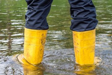 Person walking through flood water