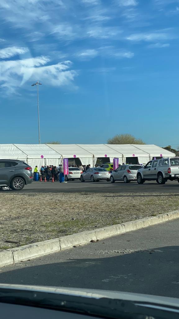 Vehicles accessing drive-through vaccination