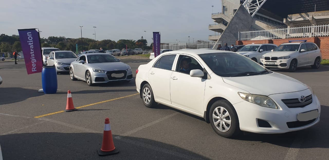 Vehicles waiting their turn to access vaccination via the drive-through