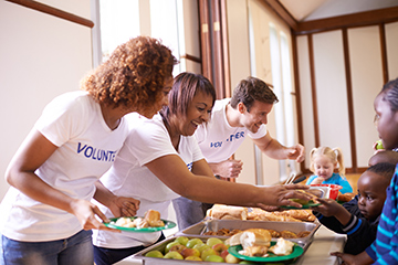 A group of volunteers at a soup kitchen. 