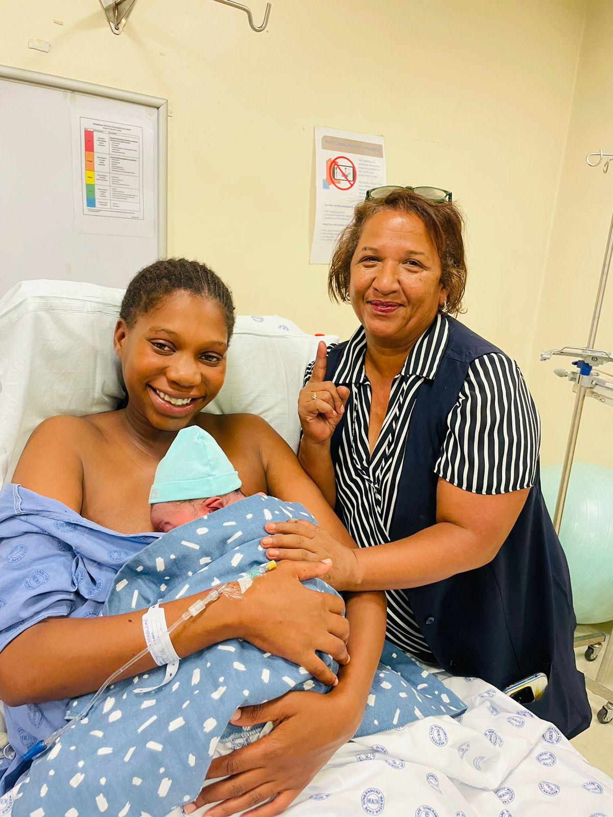 Mantombi Ndabezimbi, her baby boy and Sister Brenda Buckton.