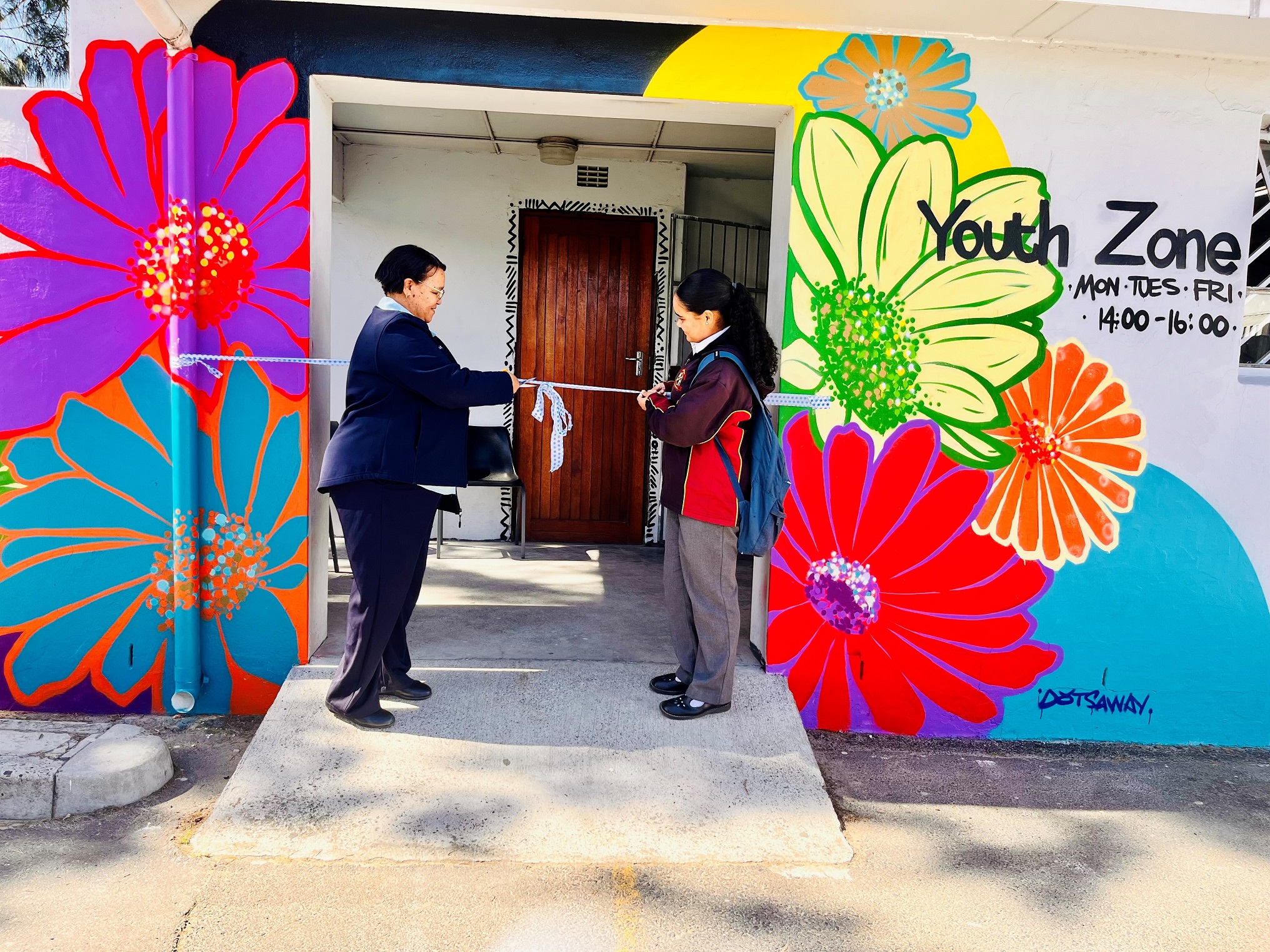 Bellville South Community Day Centre manager, Sr Caty May, is joined by a learner during the ribbon-cutting ceremony of the new youth-friendly clinic at the CDC.